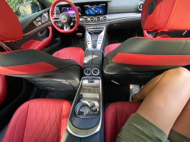 A photo of my legs squeezed into the back seat of the AMG GT