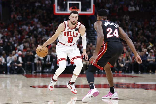 Nov 20, 2023; Chicago, Illinois, USA; Chicago Bulls guard Zach LaVine (8) brings the ball up court against Miami Heat forward Haywood Highsmith (24) during the first half at United Center.