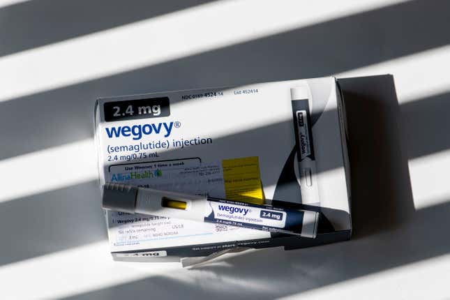 Flatlay of an Wegovy injectable prescription on top of its box