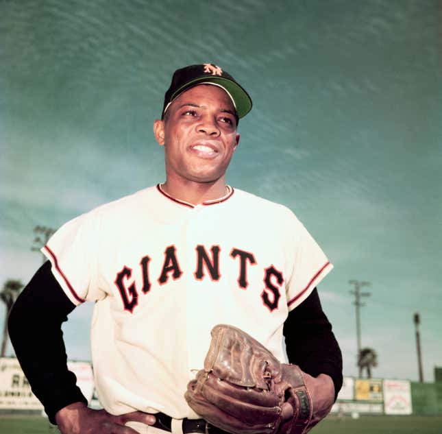 Willie Mays of the New York Giants. Waist-up photograph with hands on his hips.