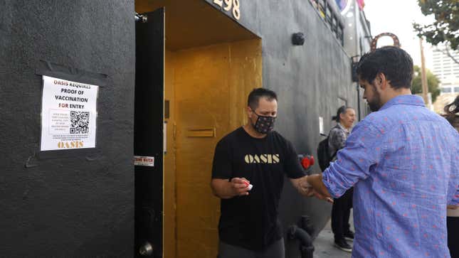 A doorman at Oasis checks a customer's vaccination card before allowing him to enter on July 29, 2021 in San Francisco, California.