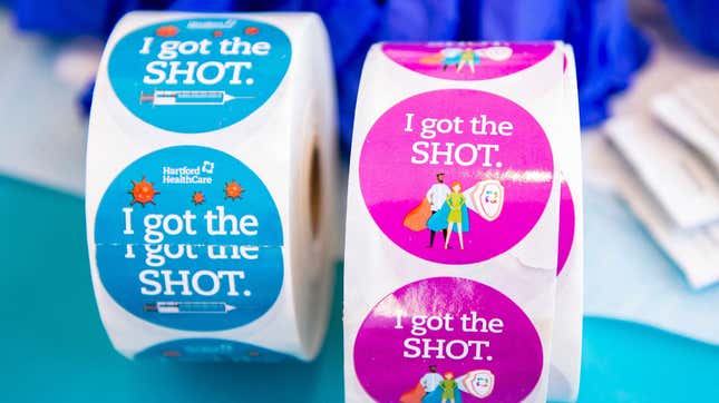 Stickers for the clergy to wear after they receive the vaccine sit on a table at Hartford HealthCare St. Vincents Medical Center in Bridgeport, Connecticut on February 26, 2021. 