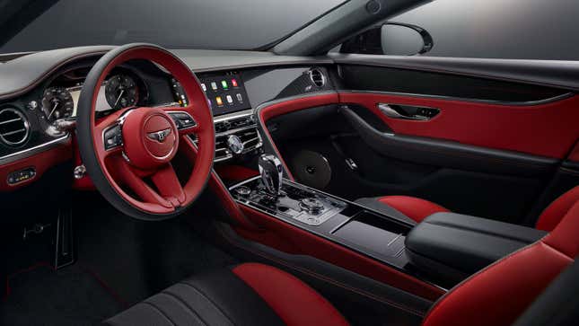 A photo of the red and black interior of a Bentley. 