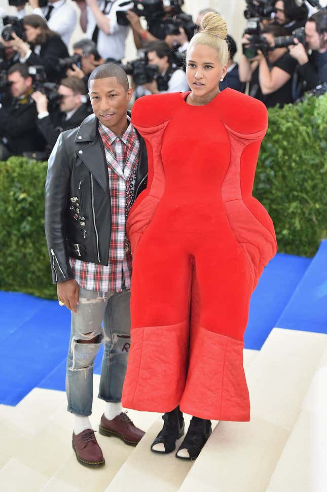 Pharrell Williams (L) and Helen Lasichanh attend the “Rei Kawakubo/Comme des Garcons: Art Of The In-Between” Costume Institute Gala at Metropolitan Museum of Art on May 1, 2017 in New York City.