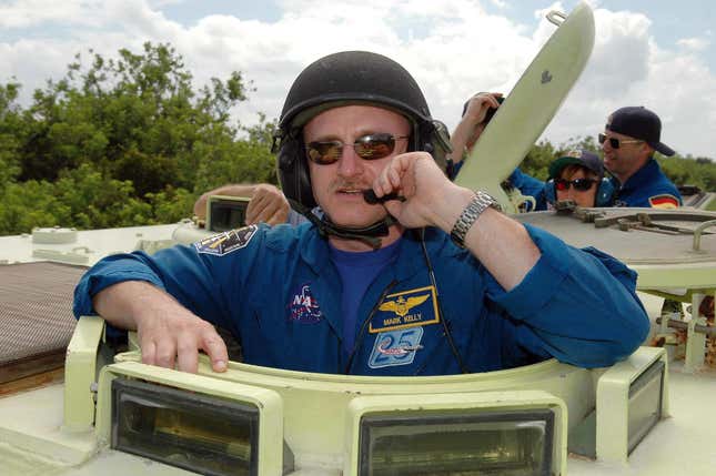 Commander Mark Kelly is ready to practice driving the M113 armored personnel carrier