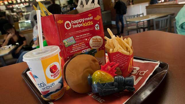 McDonald's Happy Meal with fries, burger, soda, and toy