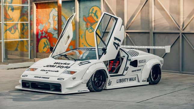 Front 3/4 view of a white Lamborghini Countach with a Liberty Walk body kit