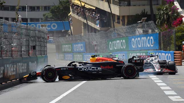 Sergio Perez of Mexico driving the (11) Oracle Red Bull Racing RB20 and Kevin Magnussen of Denmark driving the (20) Haas F1 VF-24 Ferrari (obscured) crash at the start during the F1 Grand Prix of Monaco at Circuit de Monaco on May 26, 2024 in Monte-Carlo, Monaco. 