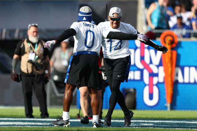 ORLANDO, FLORIDA - FEBRUARY 04: D’Andre Swift #0 of the Philadelphia Eagles and Amon-Ra St. Brown #14 of the Detroit Lions and NFC celebrate after a score during the first half of the 2024 NFL Pro Bowl Games at Camping World Stadium on February 04, 2024 in Orlando, Florida. (Photo by Megan Briggs/Getty Images)