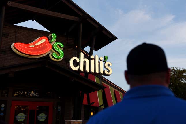 A customer walks towards the entrance of a Chili’s Grill &amp; Bar restaurant in San Antonio, Texas, U.S. 