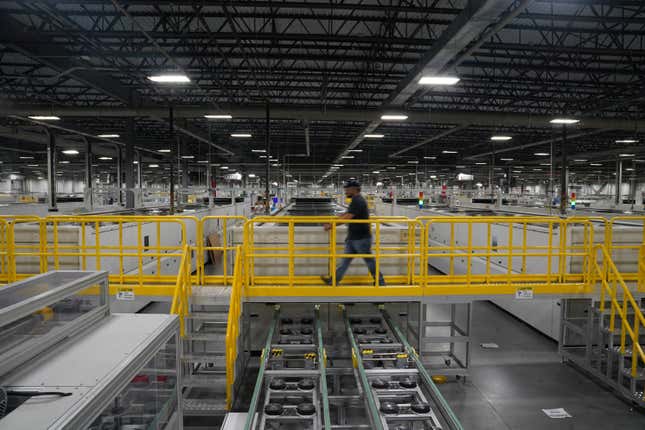 An employee works on solar panels at the QCells solar energy manufacturing factory in Dalton, Georgia, U.S., March 2, 2023.