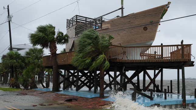 Surf breaks over the foundation on a house shaped like a boat in Horseshoe Beach, Florida, as Debby makes landfall