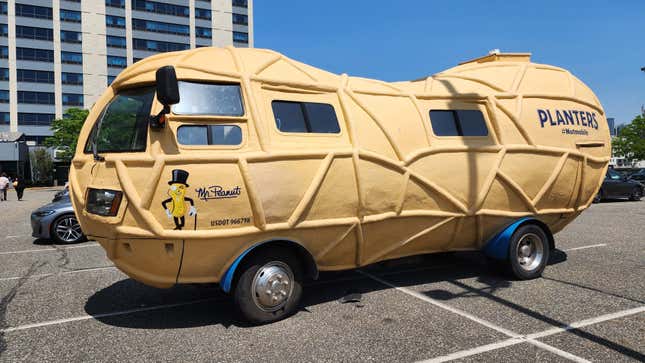 A side view of the nutmobile in a parking lot