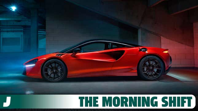 A side profile image of an orange McLaren Artura in a parking garage