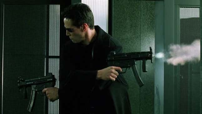 Neo opens fire in two directions in The Matrix's iconic lobby shoot-out scene.
