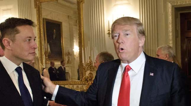 US President Donald Trump greets Elon Musk, SpaceX and Tesla CEO, before a policy and strategy forum with executives in the State Dining Room of the White House February 3, 2017 in Washington, DC.