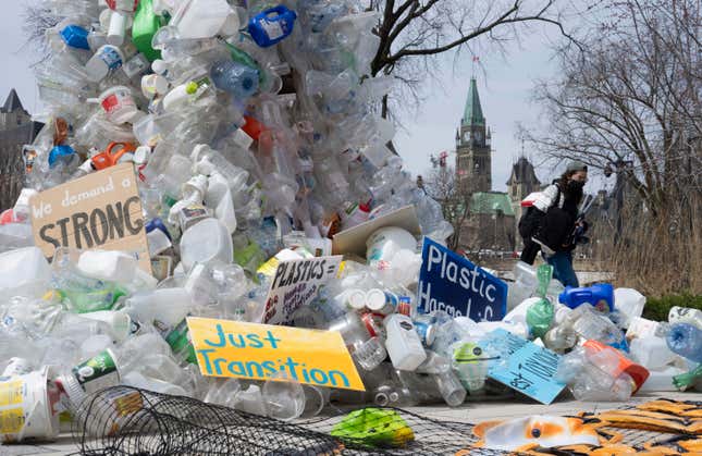 FILE - A person walks past an art installation outside a United Nations conference on plastics on April 23, 2024, in Ottawa, Ontario. (Adrian Wyld/The Canadian Press via AP, File)