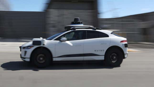 A Waymo car drives along a street on March 01, 2023 in San Francisco, California.