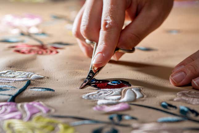 Close-up view of an artist creating embroidery