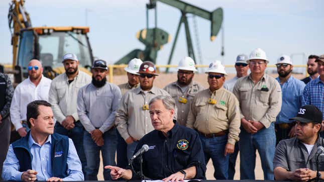 Drill, baby, drill. Texas Governor Greg Abbott, center, speaks during a press conference in the Permian Basin related to his re-election campaign Tuesday, Feb. 1, 2022, in Midland, Texas. 