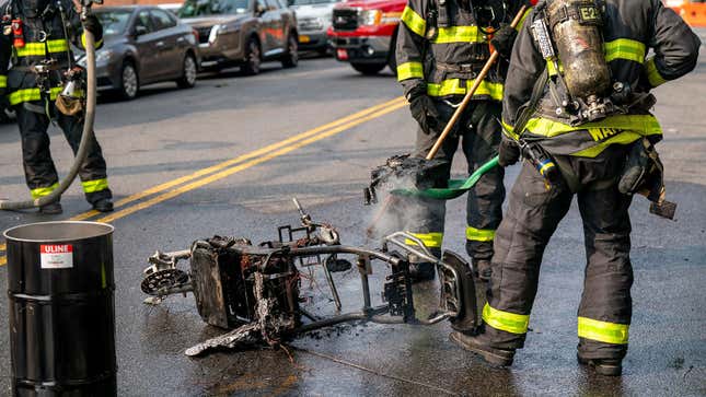 A photo of NYFD fire fighters putting out an e-bike fire. 