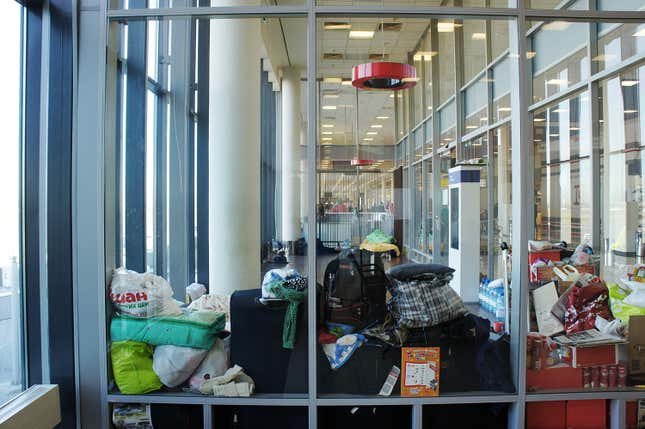Image for article titled Photos: A family of Kurdish refugees is living in a Moscow airport lounge