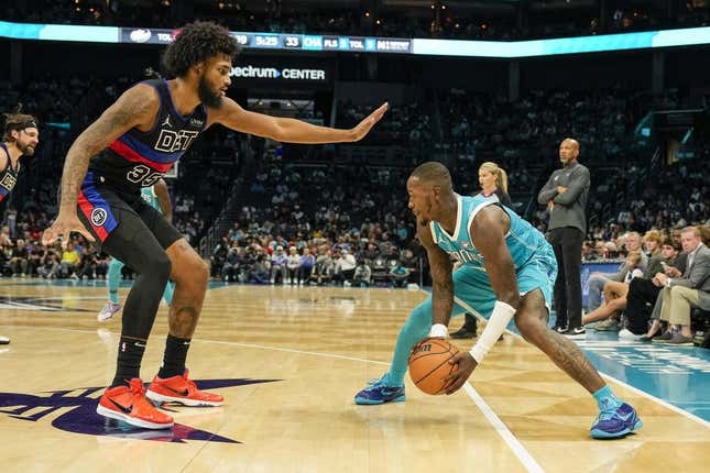 Oct 27, 2023; Charlotte, North Carolina, USA; Charlotte Hornets guard Terry Rozier (3) handles the ball against Detroit Pistons forward Marvin Bagley III (35) during the second quarter at Spectrum Center.