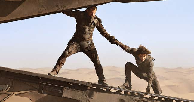 Josh Brolin's Gurney Halleck grabbing Timotée Chalamet's Paul Atreides to keep him steady on the landing ramp in a scene from Dune.