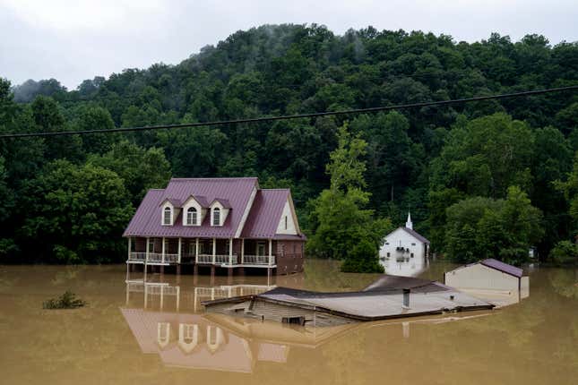 A house is seen almost completely submerged off of the Bert T Combs  Mountain Parkway on July 29, 2022 in Breathitt County, Kentucky. 