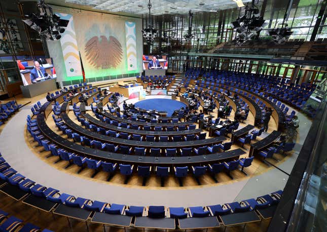 UN meeting with empty chairs.