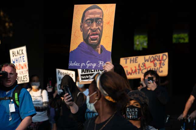 People march following the guilty verdict in the trial of Derek Chauvin on April 20, 2021, in Atlanta, Georgia.