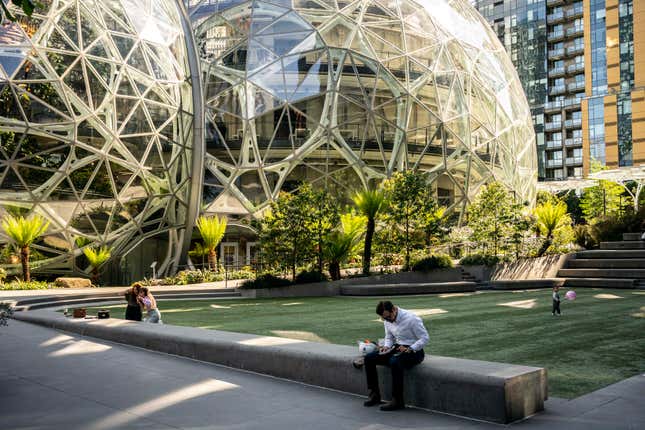 People use a common space outside of The Spheres at the Amazon.com Inc. headquarters. 