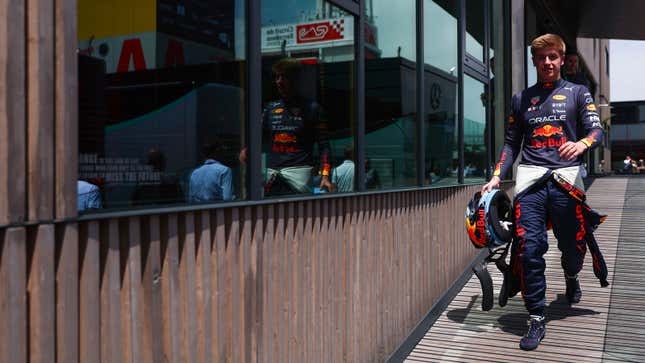 A photo of racing driver Juri Vips in Red Bull coveralls. 