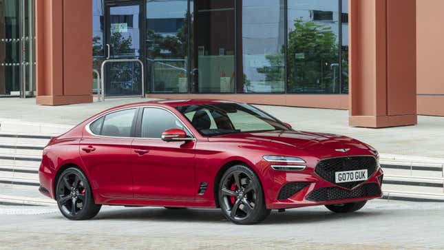 A photo of a red Genesis G70 sedan. 