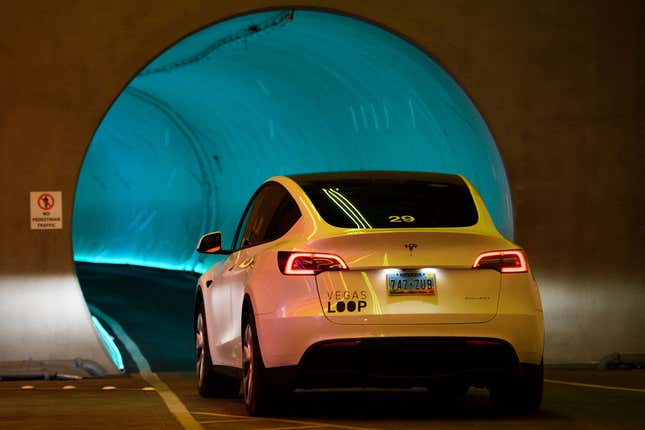 A Tesla electric car drives around the Las Vegas Convention Center Loop ahead of the Consumer Electronics Show (CES) at the Las Vegas Convention Center on January 3, 2022 in Las Vegas, Nevada.