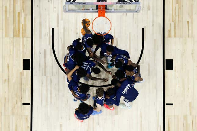 FILE - Saint Peter&#39;s players huddle before the second half of a college basketball game against Purdue in the Sweet 16 round of the NCAA tournament, Friday, March 25, 2022, in Philadelphia. The online sports betting company PointsBet committed three different types of violations of New Jersey sports betting laws, including taking bets on soccer games that had already ended, according to gambling regulators who fined the company $25,000. PointsBet accepted bets on March 25, 2022 on the St. Peter&#39;s men&#39;s basketball team, but which was ineligible to be bet on in New Jersey. The market for St. Peter&#39;s bets was live for 55 minutes and two people placed bets, totaling $60. Both were canceled. (AP Photo/Chris Szagola, File)