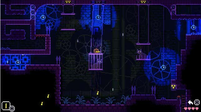 The cages holding cats in Animal Well hang over a section of the map. 