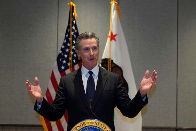 FILE - California Gov. Gavin Newsom speaks at a press conference in Beijing, Oct. 25, 2023. Newsom signed hundreds of new laws in 2023 that will take effect in California on Jan. 1, 2024. (AP Photo/Ng Han Guan,File)