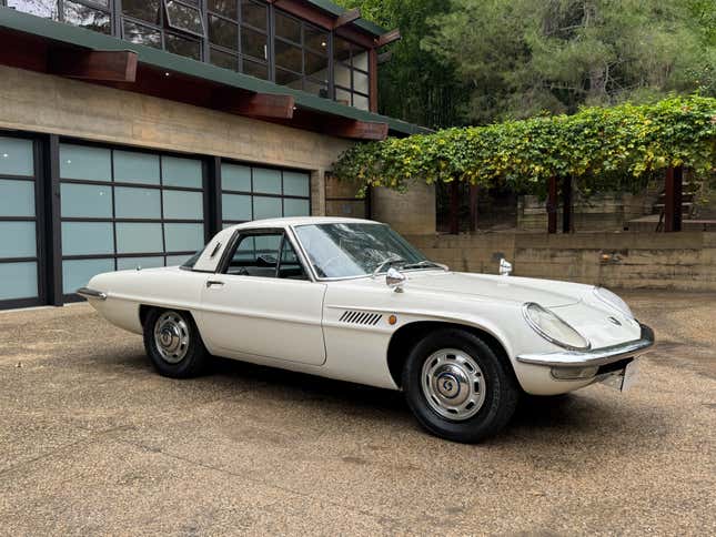 Front 3/4 view of a white Mazda Cosmo 110S