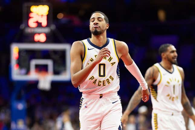 Nov 14, 2023; Philadelphia, Pennsylvania, USA; Indiana Pacers guard Tyrese Haliburton (0) reacts to his three point score against the Philadelphia 76ers during the second quarter at Wells Fargo Center.