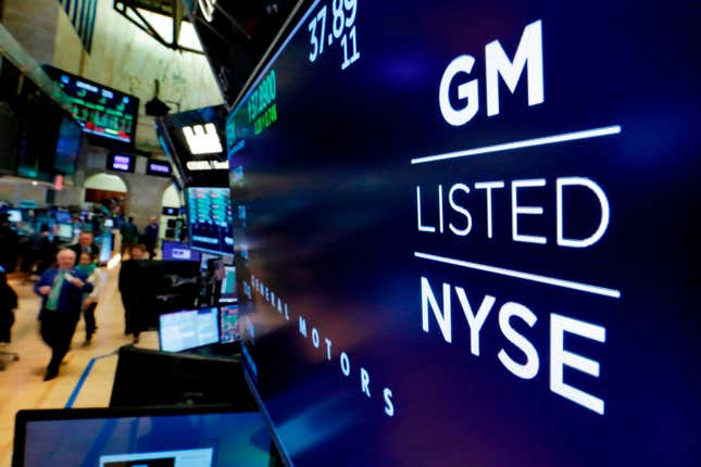 FILE- In this April 23, 2018, file photo, the logo for General Motors appears above a trading post on the floor of the New York Stock Exchange. General Motors reports earnings on Tuesday, Oct. 24, 2023. (AP Photo/Richard Drew, File)