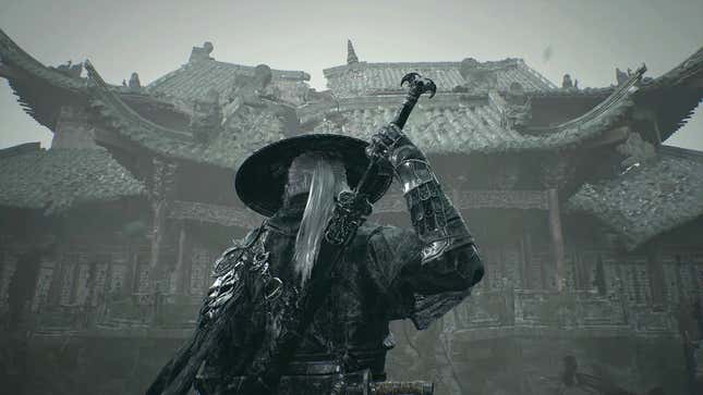 A white-haired figure in black garb has a hand on the hilt of their sword as they face a building whose design is reminiscent of traditional Japanese architecture.