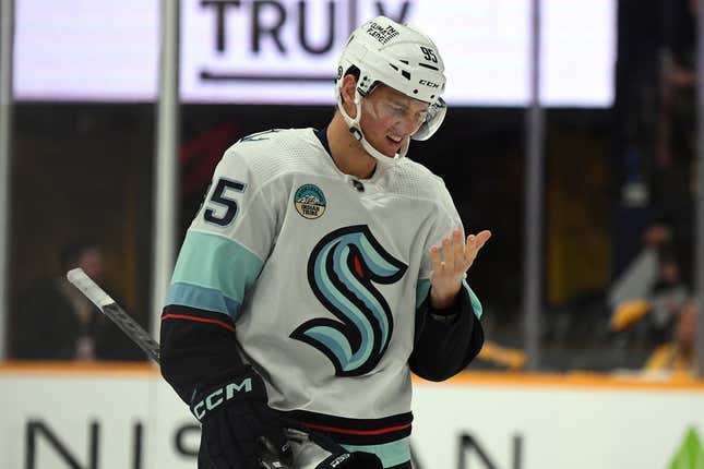 Oct 12, 2023; Nashville, Tennessee, USA; Seattle Kraken left wing Andre Burakovsky (95) checks his face for blood after being hit with a high stick during the third period against the Nashville Predators at Bridgestone Arena.