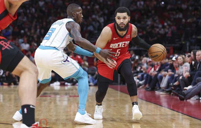 Nov 1, 2023; Houston, Texas, USA; Houston Rockets guard Fred VanVleet (5) controls the ball as Charlotte Hornets guard Terry Rozier (3) defends during the third quarter at Toyota Center.