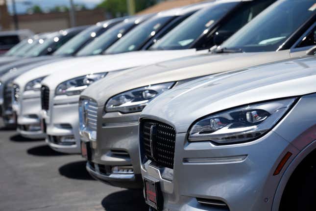 File - Unsold 2023 Aviator sports-utility vehicles sit in a long row at a Lincoln dealership on June 18, 2023, in Englewood, Colo. The strike against Detroit&#39;s three automakers didn&#39;t make much of a dent in auto sales last month. (AP Photo/David Zalubowski, File)