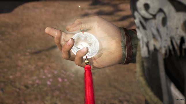 A screenshot from Dynasty Warriors: Origins. The protagonist is holding a glowing medal.