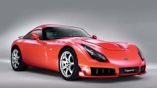 A photo of a red TVR sports car in a studio. 