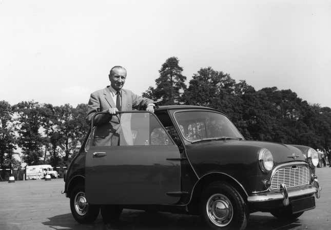 Alec Issigonis, the designer of the Morris Mini-Minor with one of the cars at the Fighting Vehicles Research and Development Establishment in Chertsey, Surrey, U.K..