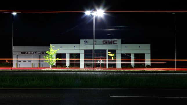 A photo of a closed GMC dealer at night. 