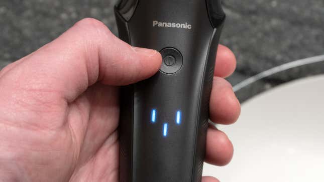 The Arc6's power button being used to put it into cleaning mode.